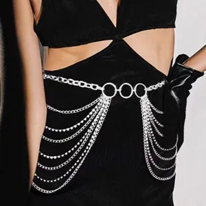 Detail of silver multi-layer metal waist chain with rhinestone tassels and rings