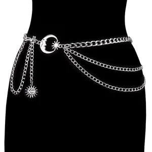 Close-up of silver layered waist chain with celestial crescent moon and sun pendants