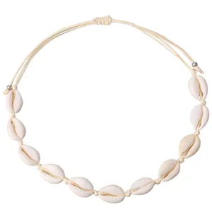 Detailed view of bohemian choker featuring natural white shells and adjustable woven cord