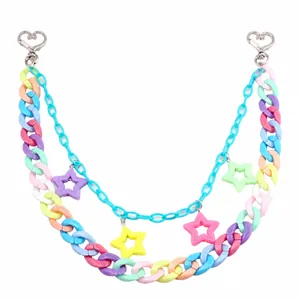 Detail of colorful acrylic star charms and multi-layer chain with silver heart clasps