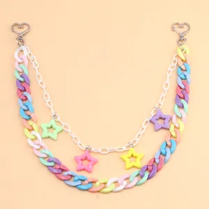 Detail of macaron acrylic layered pants chain with colorful star charms and heart clips