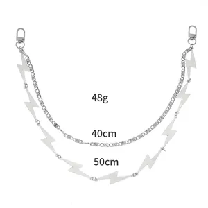 Close-up of double-layered silver lightning chain with lobster clasps and weight detail