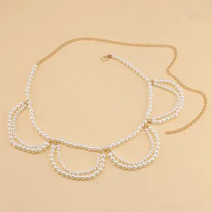 Detailed macro view of French vintage pearl waist chain with adjustable gold lobster clasp