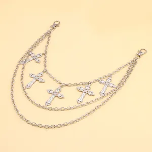 Close-up of triple-layered silver waist chain with five gothic hollow cross pendants
