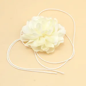 Detailed close-up of a cream 3D fabric flower choker with elegant satin petals and ribbons