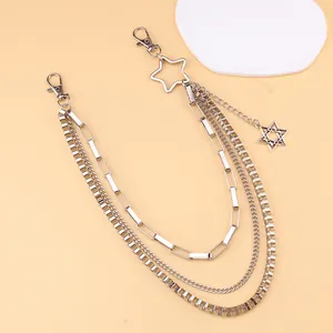 Detailed shot of multilayer punk waist chain with silver stars and lobster clasps