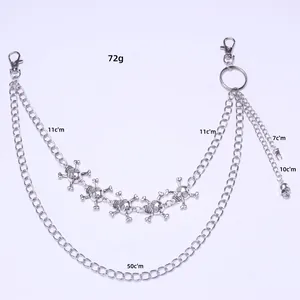 Detail of silver punk hip hop wallet chain with skull pendants and lobster clasps