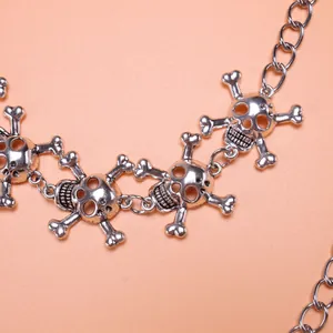 Macro detail of silver gothic metal skull and crossbones chain links for hip hop style