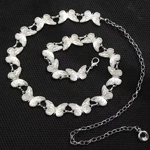 Silver butterfly metal waist chain belt with vintage punk style on black background
