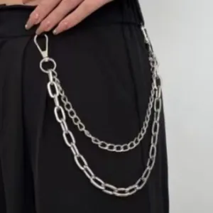 Punk style double layered silver metal pants chain with lobster clasps on black trousers