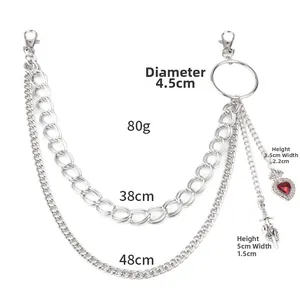 Detail of multi-layer silver hip hop pants chain with red heart and sword pendants