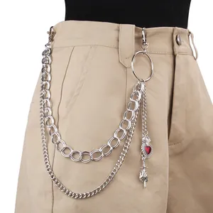 Punk multi-layer silver pants chain with red heart and sword pendants on khaki trousers