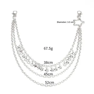 Detailed close-up of triple-layered silver metal waist chain with pentagram star charms