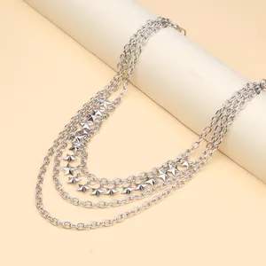 Multilayer silver hip hop waist chain with metallic stars on a minimalist beige background