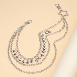 Detail of multi-layered silver hip-hop waist chain with solid metallic star pendants