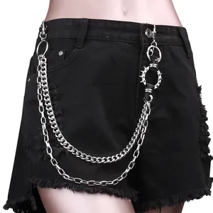 Punk style black denim shorts featuring double metal chains and spiked ring accessories