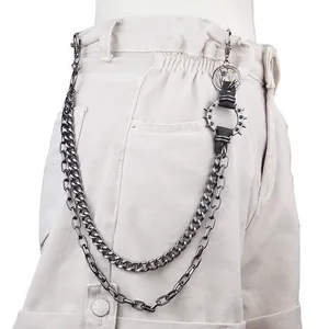 Punk style silver layered waist chain with metal spikes and rivet rings on cargo pants