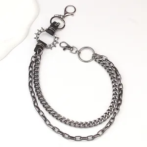 Close-up of multi-layer metallic pants chain with spikes and dark silver punk clasps