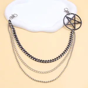 Detail of three-layer hip hop pants chain with silver pentagram pendant and metal clasps