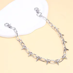 Close-up of silver punk pants chain with metallic spikes and sturdy lobster clasps