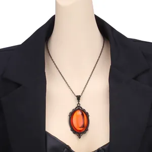 Gothic vintage necklace with orange quartz crystal pendant on a black chain