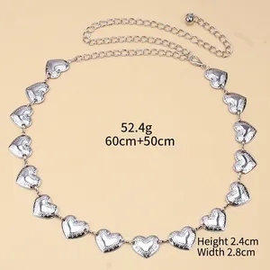 Detail of silver heart metal waist chain with vintage texture and adjustable links