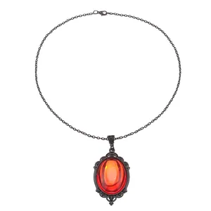 Gothic quartz crystal necklace with oval red gemstone in vintage black ornate setting