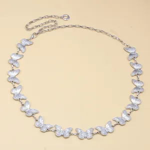 Detailed view of silver butterfly waist chain with adjustable lobster clasp closure