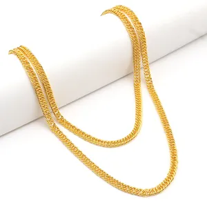 Hip hop style chunky gold plated cross pant chain displayed on a white pedestal