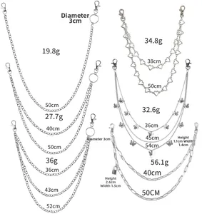 Detail view of various punk style hip-hop chain accessories with butterfly and lock charms