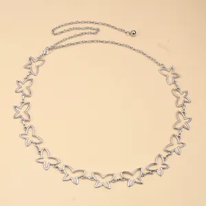 Close-up of hollow butterfly links and lobster clasp on silver metal waist chain