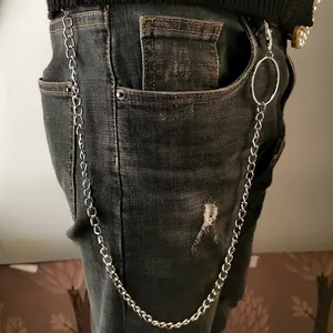 Silver punk hip hop waist chain with large metal ring and clasps on grey denim jeans