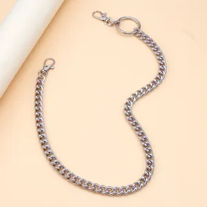 Close-up of polished silver metal pant chain with lobster clasps and ring detail
