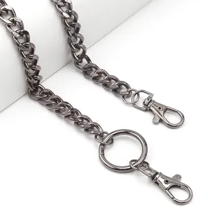 Detail of gunmetal punk curb chain with two lobster clasps and large metal ring accessory