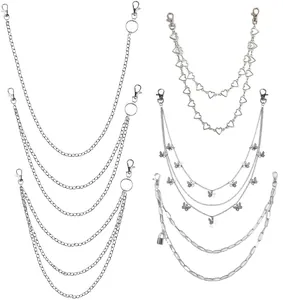 Detail of punk style silver metal pant chains with butterfly heart and lock pendants