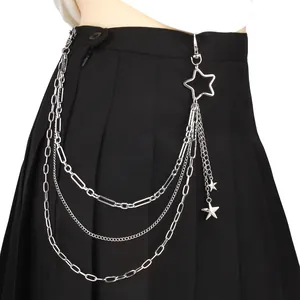 Multilayer silver metal waist chain with hollow and solid star pendants on black skirt