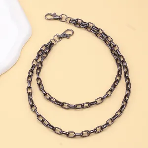 Detail of gunmetal black box chain accessories with sturdy lobster clasps for pants