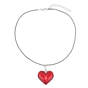 Fashionable bright red heart glass pendant on a minimalist black cord necklace