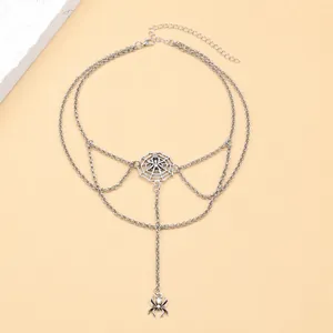 Detail of gothic multilayer necklace with spider pendant and web design measurements