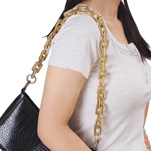 Fashionable black crocodile pattern underarm bag with bold gold metal chain link strap