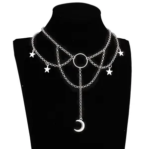 Layered punk crescent moon necklace with silver stars and gothic chain on a display