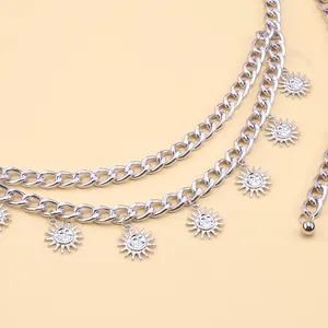 Macro view of silver multilayer hip hop waist chain with sun smile face metal pendants