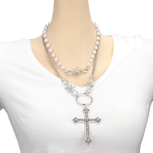 Double-layered pearl necklace with gothic cross pendant and silver thorn lock design