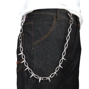 Hip-hop punk silver metal wallet chain with spiked studs on black denim pants