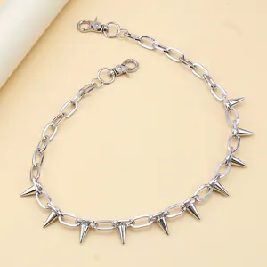 Detail of silver punk chain with sharp metal studs and dual lobster clasps accessory
