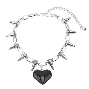 Punk style silver chain necklace with metal spikes and black heart pendant