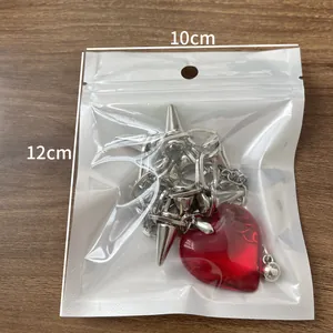 Y2K punk style heart pendant necklace with metal spikes in 10x12cm packaging