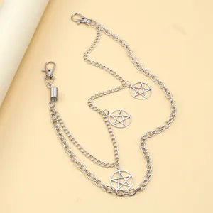 Detail of silver multi-layer waist chain featuring star charms and lobster clasps
