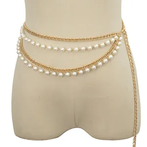 Elegant multilayer gold metal waist chain with faux pearls on a display mannequin
