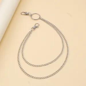 Detail view of double-layered silver metal pants chain with lobster clasps and ring